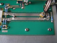 Picture of the input circuit, smaller trimmer capacitor and ATC used. With excellent return loss.<br />It is not a good idea to tune it with a metal screw driver. If you have no plastic, turn the amp off, move the postition, turn on and repeat procedure until optimal position found.