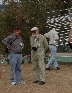 Alan (the middle the three visible folk) at the BVHFG 'Antenna Day' held in 2006.  The glimpse of some circular elements in the background was one of Alan's creations!